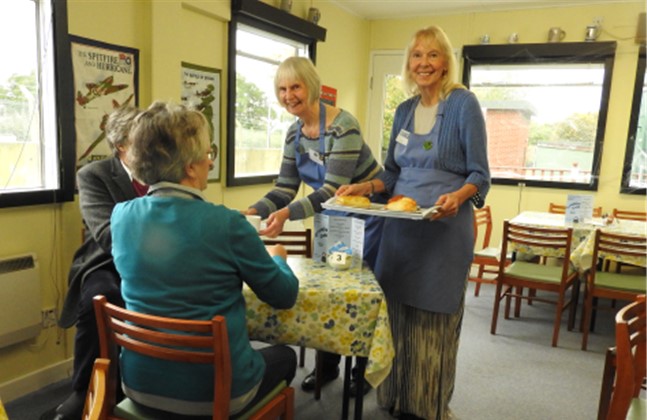 Cafe with lady's serving